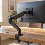 AI-generated illustration of a monitor arm, tilt pivot and desk clamp in a home office.